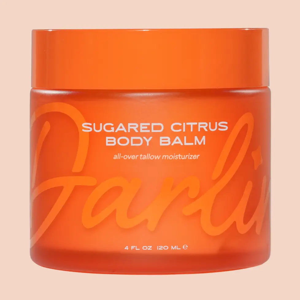 Orange jar of Sugared Citrus Body Balm with 'Farli' branding on a beige background