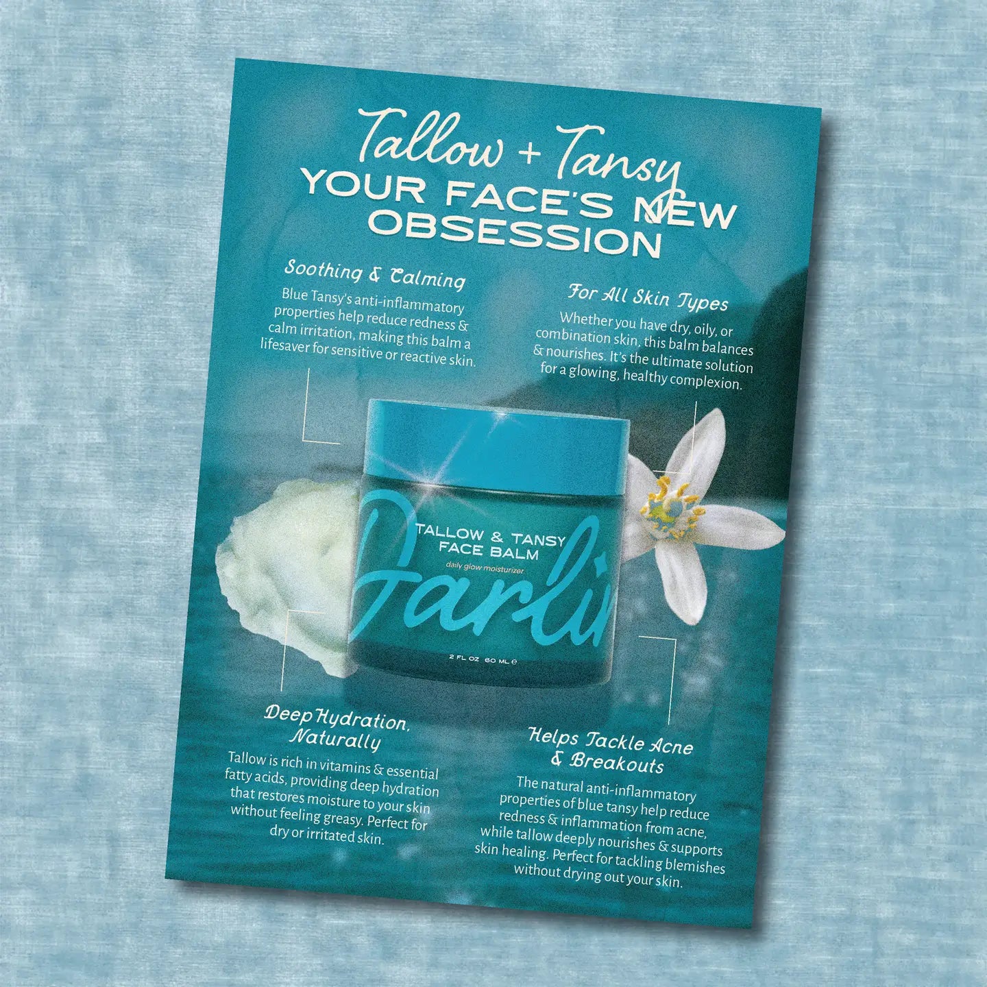 Advertisement for Tallow + Tansy face balm on a textured blue background