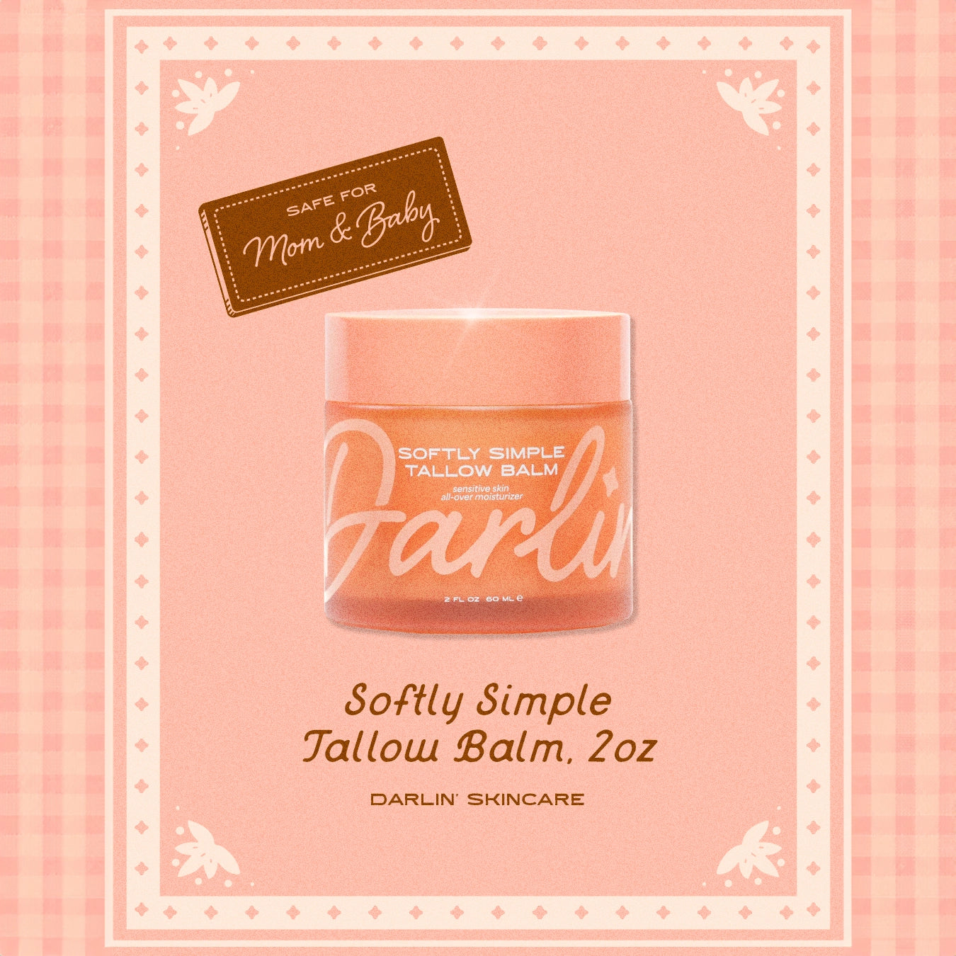 Darlin skincare tallow balm jar on a pink background with decorative elements